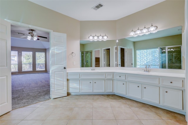 bathroom with an enclosed shower, vanity, tile patterned floors, and ceiling fan