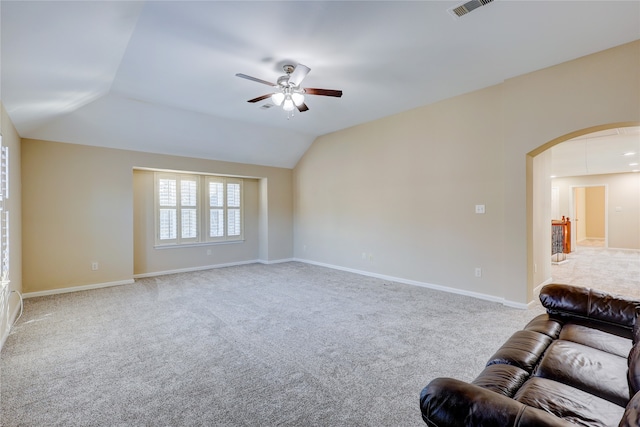 living room with carpet, ceiling fan, and lofted ceiling