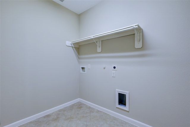 laundry area featuring hookup for a gas dryer, hookup for a washing machine, light tile patterned flooring, and hookup for an electric dryer