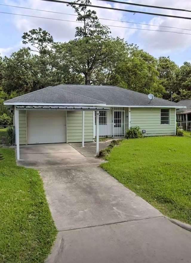 ranch-style house with a front yard and a garage