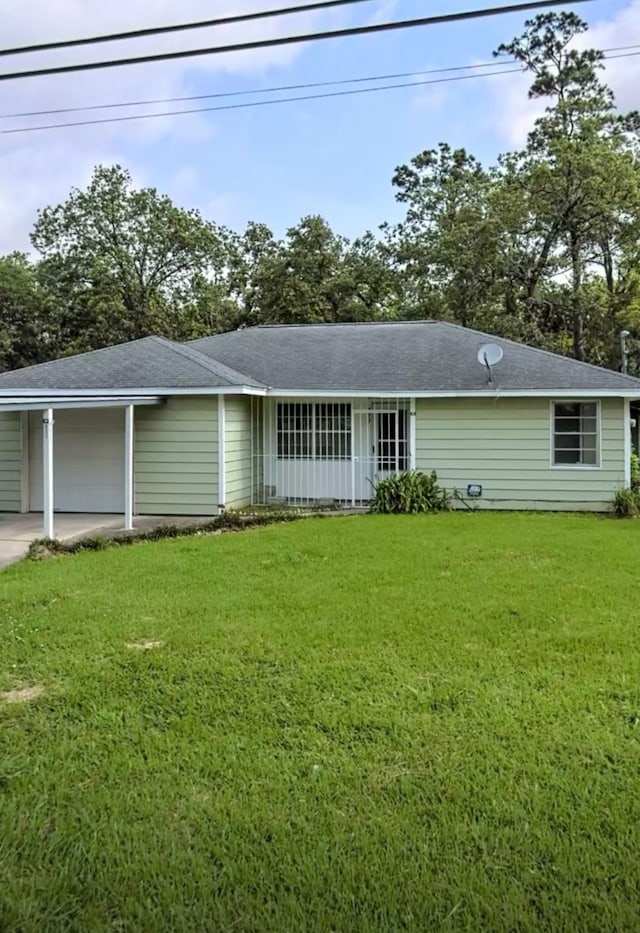 rear view of house featuring a yard