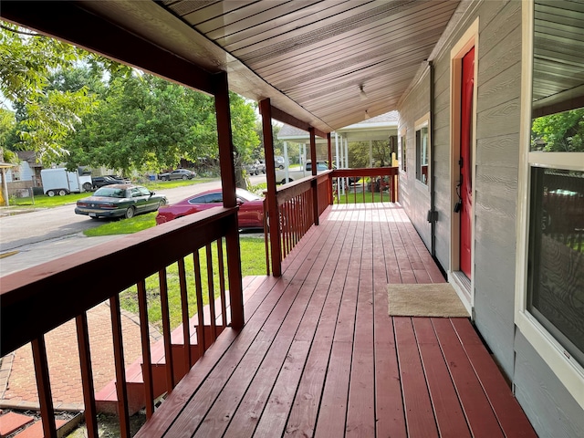 wooden deck featuring covered porch