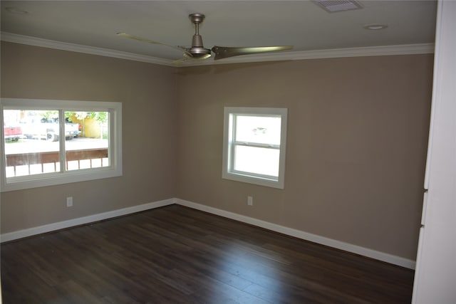 empty room with ceiling fan, dark hardwood / wood-style floors, and crown molding