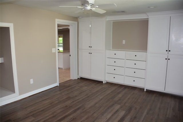 unfurnished bedroom with dark wood-type flooring and ceiling fan