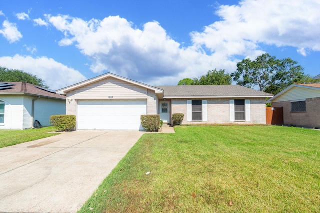 single story home featuring a garage and a front lawn