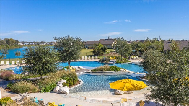 view of swimming pool with a patio