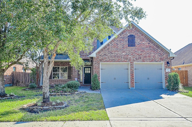 view of front of house featuring a garage and a front lawn