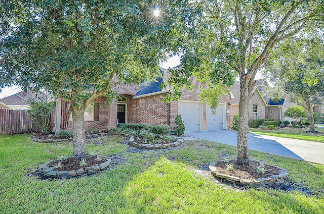 view of front of property with a front lawn and a garage