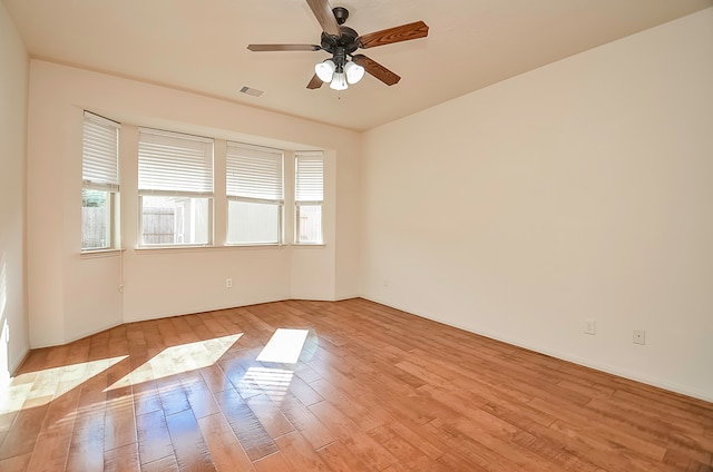 unfurnished room with ceiling fan and light hardwood / wood-style flooring