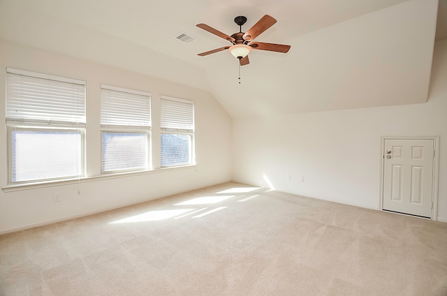 bonus room with lofted ceiling, ceiling fan, and light carpet