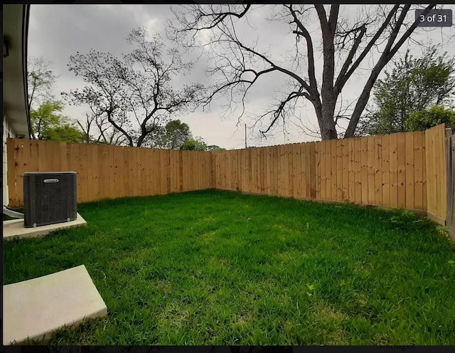 view of yard with central AC