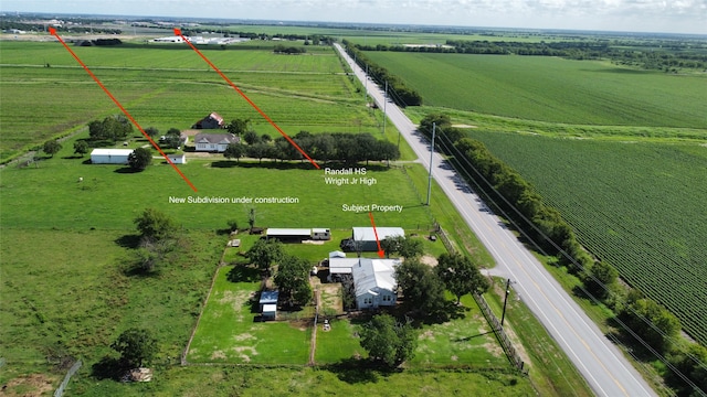 birds eye view of property featuring a rural view