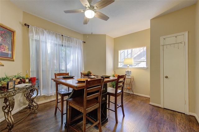 dining area with dark hardwood / wood-style floors and ceiling fan