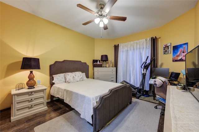 bedroom featuring hardwood / wood-style flooring and ceiling fan