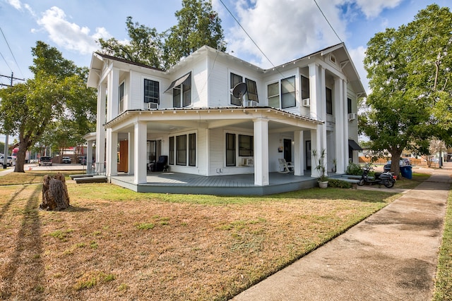 exterior space with a porch and a lawn