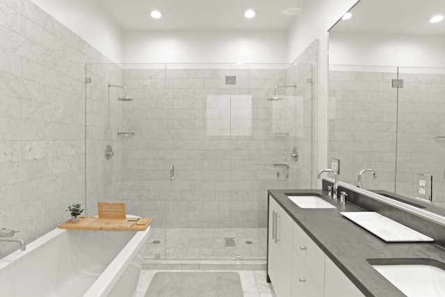 bathroom featuring vanity and separate shower and tub