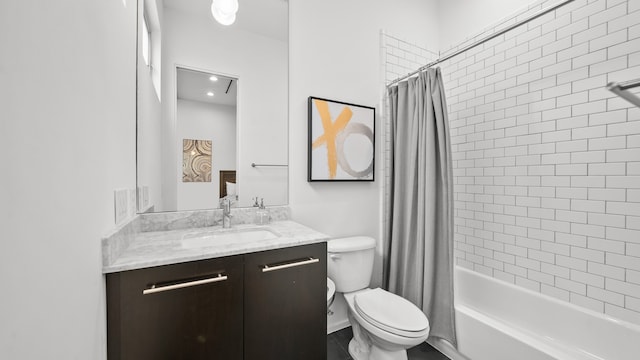 full bathroom featuring vanity, shower / bath combo, and toilet