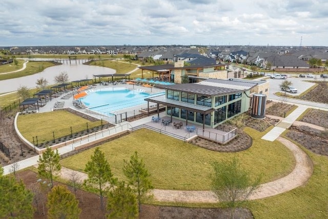 birds eye view of property featuring a water view