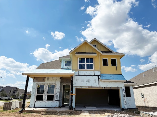 property in mid-construction with a garage