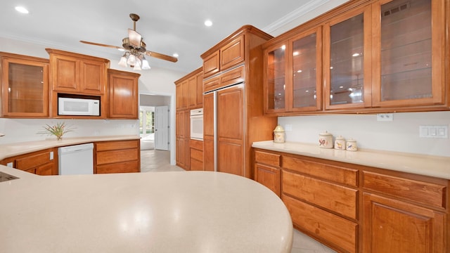 kitchen featuring ornamental molding, ceiling fan, white appliances, and light tile patterned flooring