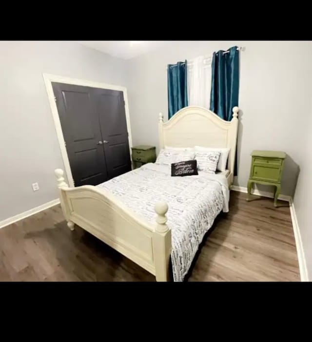 bedroom featuring hardwood / wood-style flooring