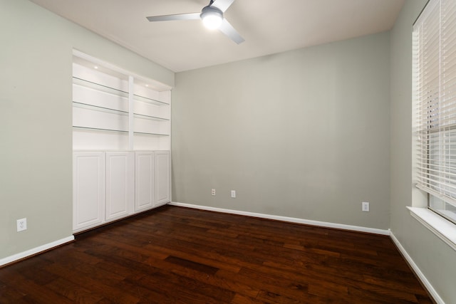 unfurnished bedroom with ceiling fan, a closet, and dark hardwood / wood-style flooring