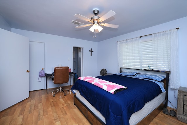 bedroom with ceiling fan and light hardwood / wood-style flooring