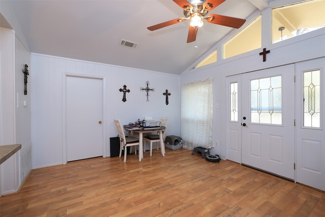 entryway with vaulted ceiling, light hardwood / wood-style flooring, and ceiling fan