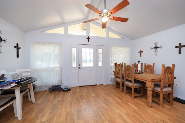 dining room with lofted ceiling, light hardwood / wood-style floors, and ceiling fan