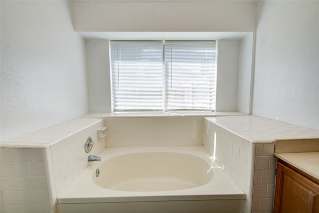 bathroom featuring vanity and a bathing tub