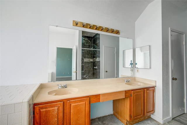 bathroom featuring an enclosed shower and vanity