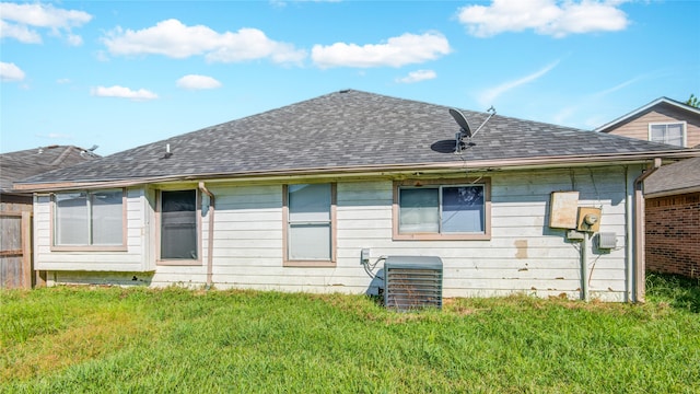 back of house with a yard