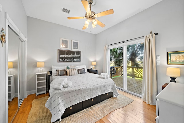 bedroom featuring ceiling fan, a closet, light hardwood / wood-style floors, and access to outside