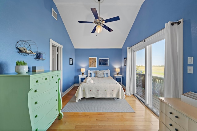 bedroom featuring ceiling fan, vaulted ceiling, access to outside, and light hardwood / wood-style flooring