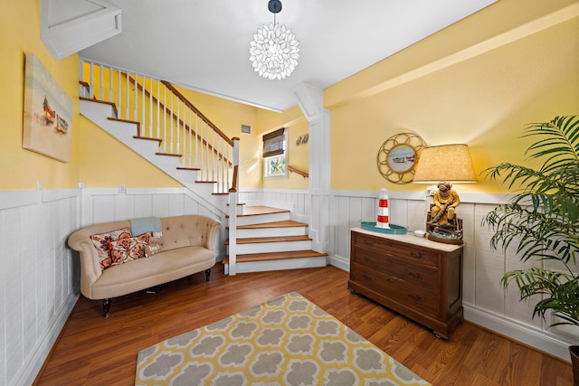 interior space with dark hardwood / wood-style floors and a notable chandelier