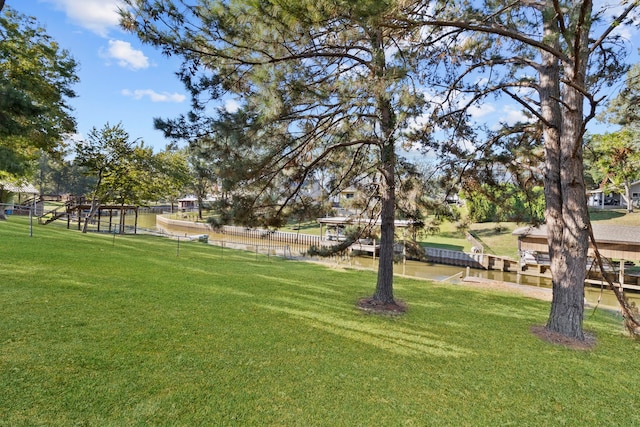 266 Water Ridge Dr, Livingston, TX 77351 - view of home's community with a yard