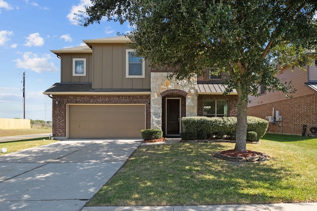 view of front of house with a front lawn and a garage