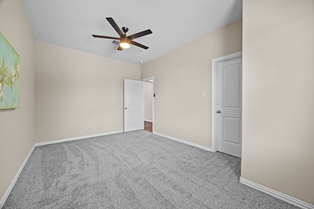 unfurnished bedroom with ceiling fan and carpet flooring