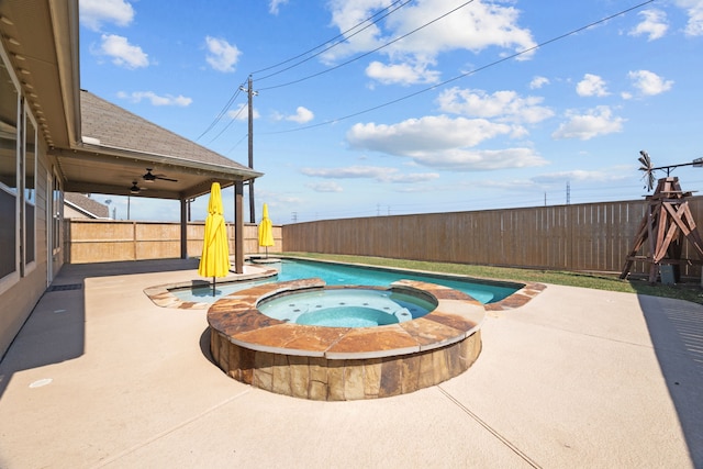 view of swimming pool with an in ground hot tub and a patio area