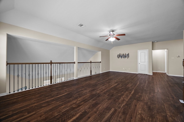 spare room featuring ceiling fan and dark hardwood / wood-style floors