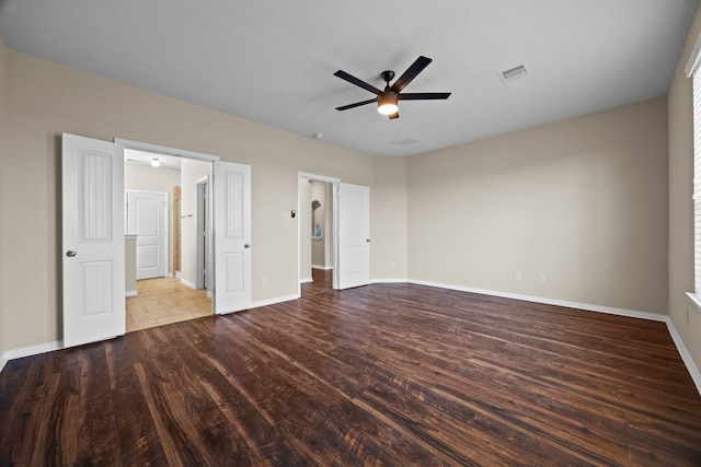 unfurnished bedroom with ceiling fan and wood-type flooring