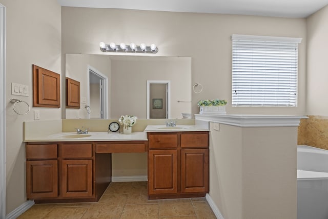 bathroom with a bathing tub, tile patterned flooring, and vanity