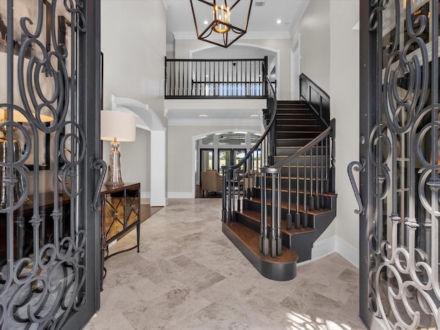 foyer featuring ornamental molding