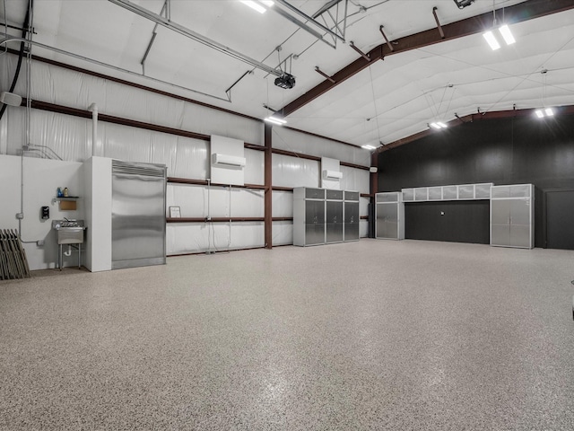 garage with sink and a garage door opener