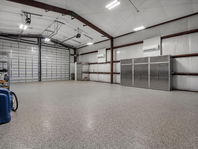 garage featuring an AC wall unit and a garage door opener