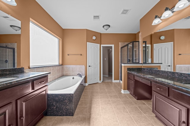 bathroom with vanity, independent shower and bath, and tile patterned floors