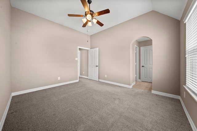 unfurnished room featuring lofted ceiling, light colored carpet, and ceiling fan