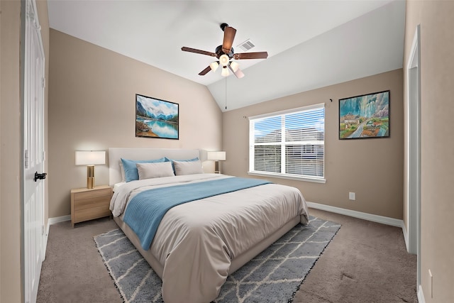 carpeted bedroom with ceiling fan and vaulted ceiling