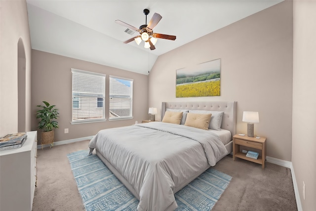 carpeted bedroom featuring ceiling fan and vaulted ceiling