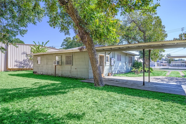 view of side of property with a yard